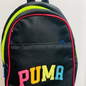 Black puma back pack multi colored lining and letters